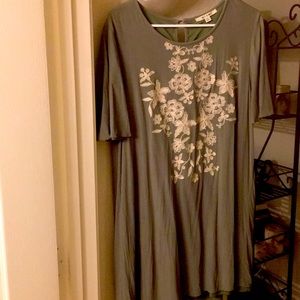 Green boutique style dress with embroidery detail